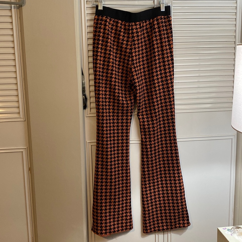 Orange and black flare pants and top